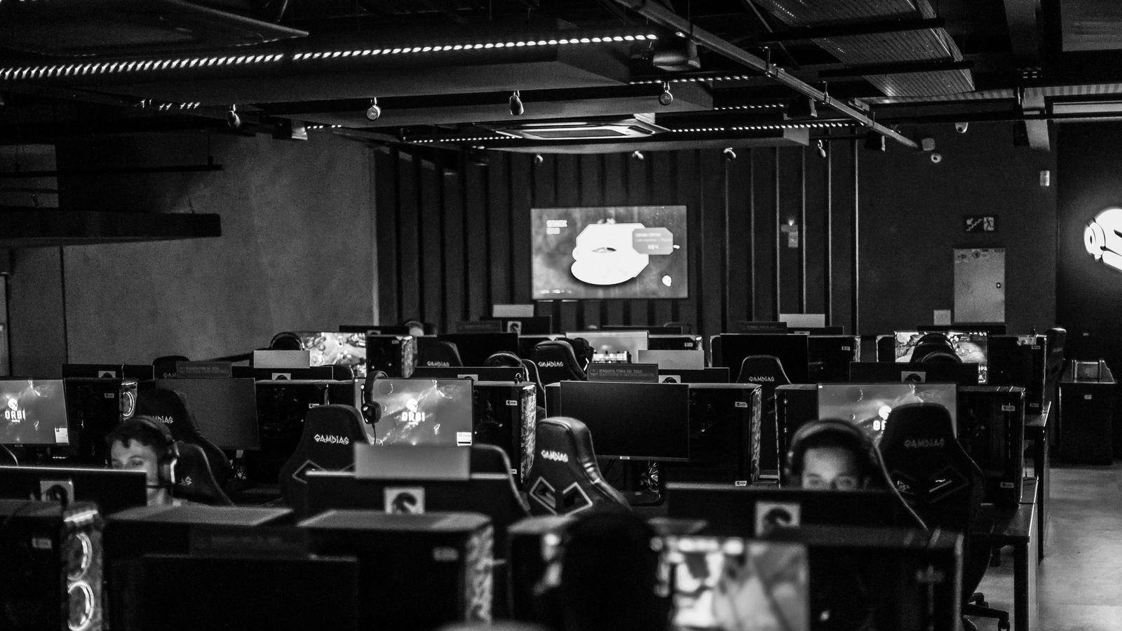 Esports arena showing a big screen and cheering crowd